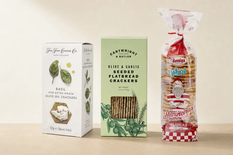 Three things for the board: a box of The Fine Cheese Co. basil and extra virgin olive oil crackers, Cartwright & Butler olive and garlic seeded flatbread crackers, and a bag of Daveiga Marineiras.